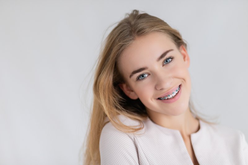 young woman smiling with braces